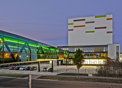 illuminated bridge from outside with administration and storage building