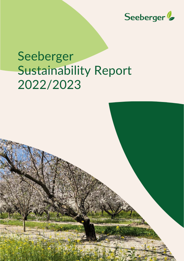 The cover picture of the Sustainability Report. The Seeberger logo can be seen at the top right. At the bottom left is a picture of a blossoming tree