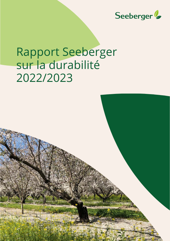 La photo de couverture du Sustainability Report. En haut à droite, on peut voir le logo de Seeberger. En bas à gauche, l'image d'un arbre en fleurs.